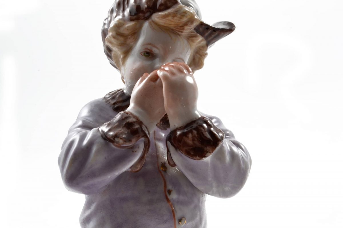 Meissen Porcelain, Hand Painted Meissen Porcelain Figurine of a Boy with a Hat. Meissen Porcelain Germany. 20th Century