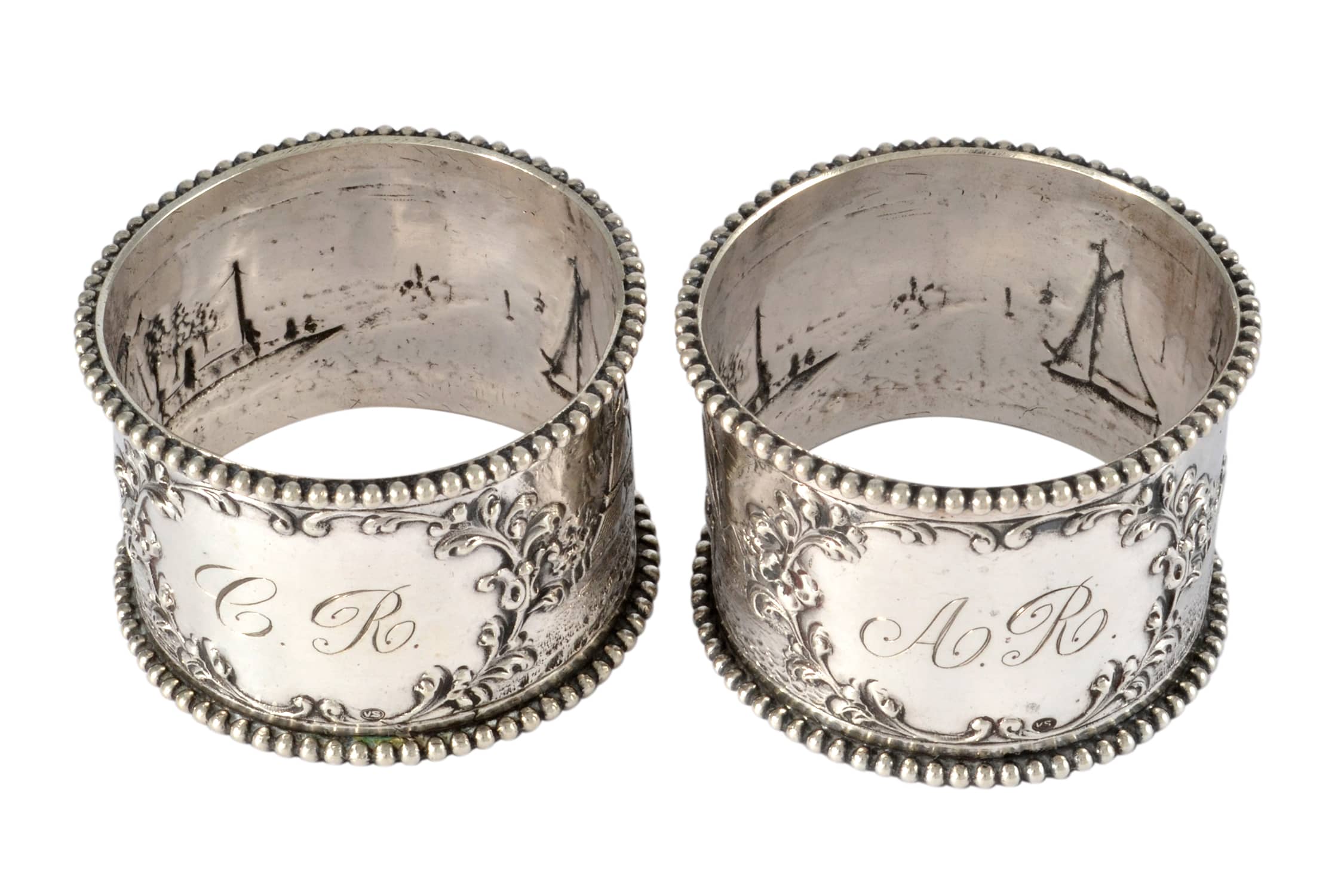 4 vintage napkin rings Not marked as silver.